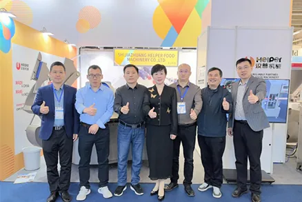 HELPER Food Machinery team at the IFFA exhibition booth
