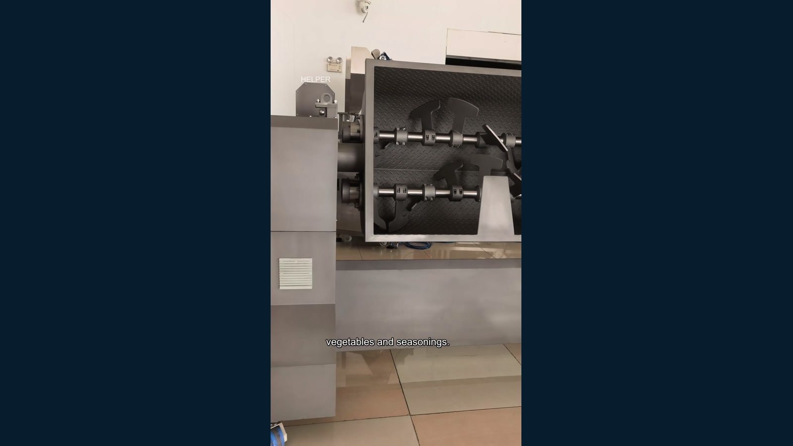 Workshop video preview showing the open twin-shaft trough of a HELPER JB-650 series mixer