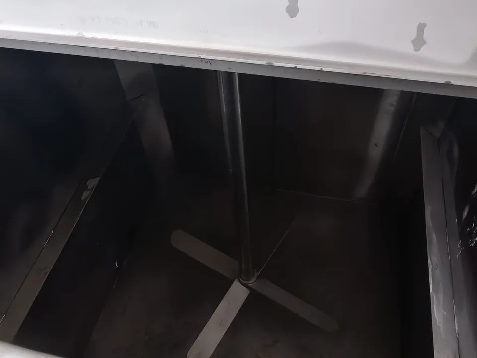 Inside the saltwater tank showing the vertical shaft and four-blade agitator