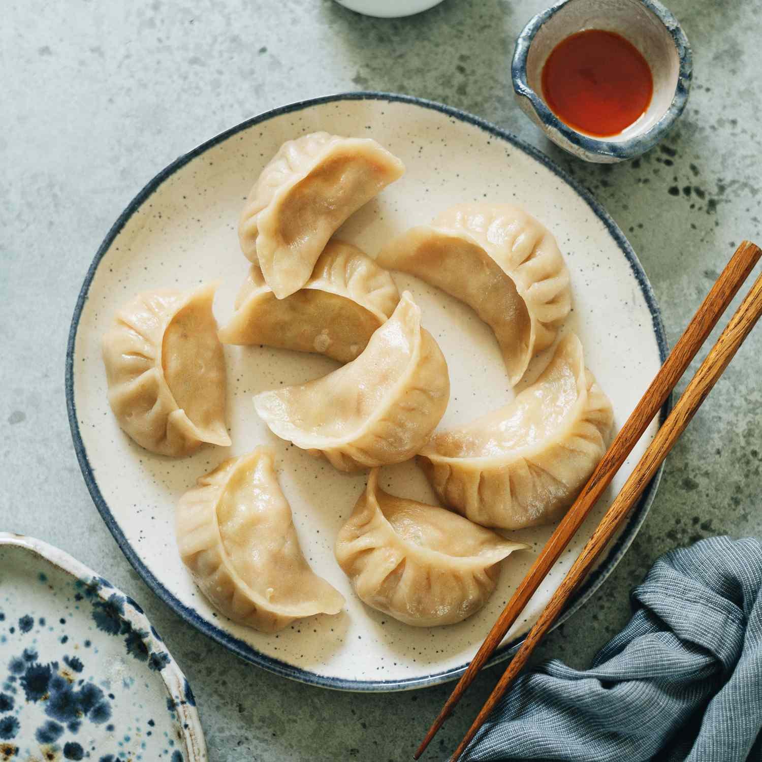 Dumpling application for vacuum-mixed dough