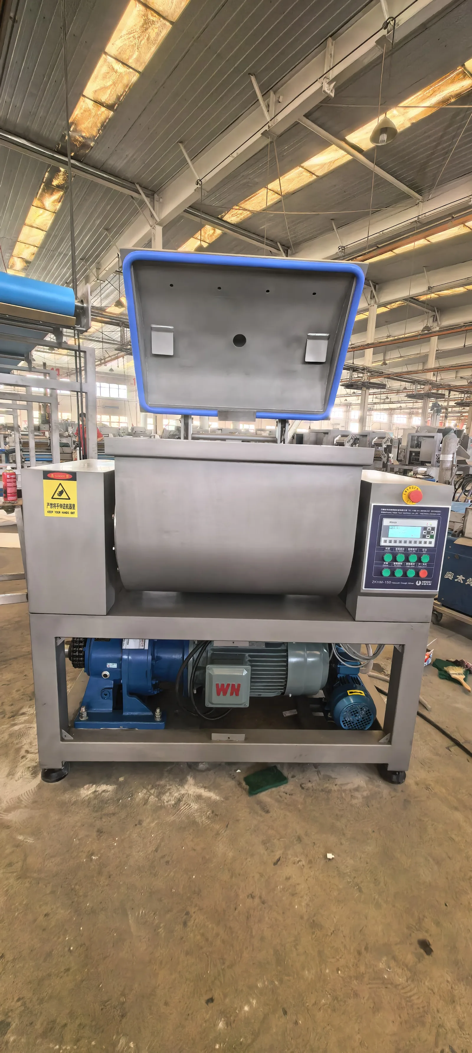 Actual HELPER ZKHM-150 vacuum dough mixer with the chamber lid open in the workshop